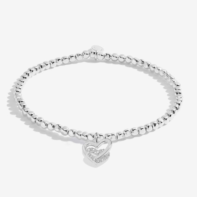 Silver plated beaded bracelet with interlinked heart charms