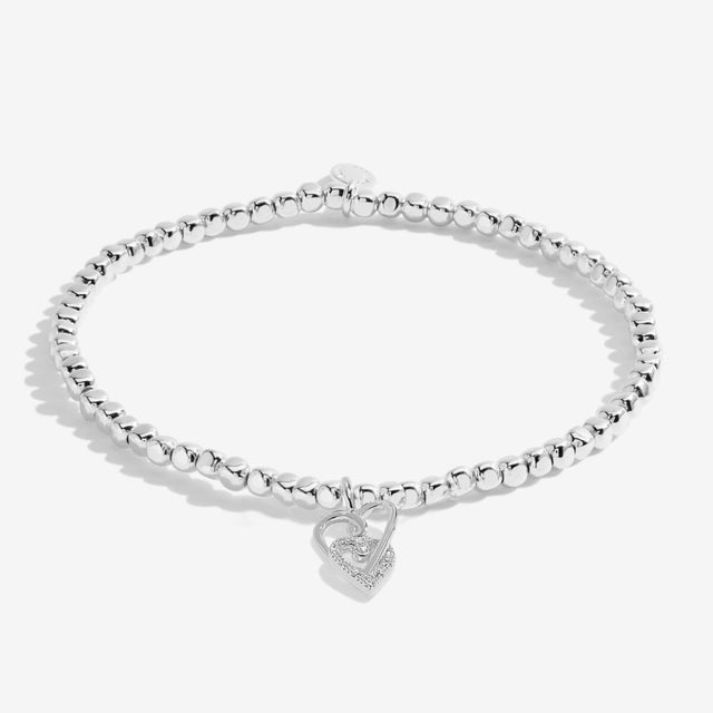 Silver plated beaded bracelet with interlinked heart charms symbolising friendship