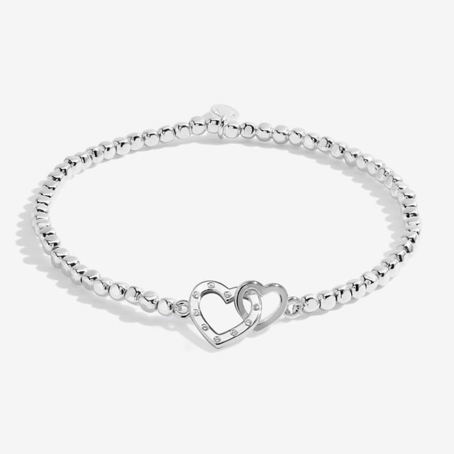 Silver plated beaded bracelet with interlinked heart charms for grandma