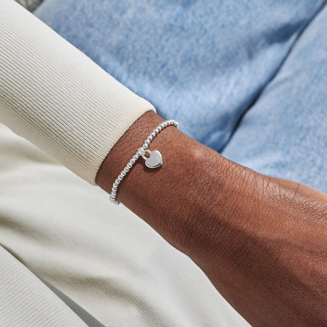 Joma A Little Lots Of Love silver bracelet worn on wrist