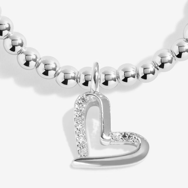 Close up of open heart charm on silver Mum bracelet