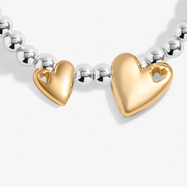 Gold heart charm detail on Lovely Granddaughter bracelet