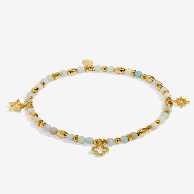 Joma Jewellery Luck gold beaded affirmation bracelet laid flat