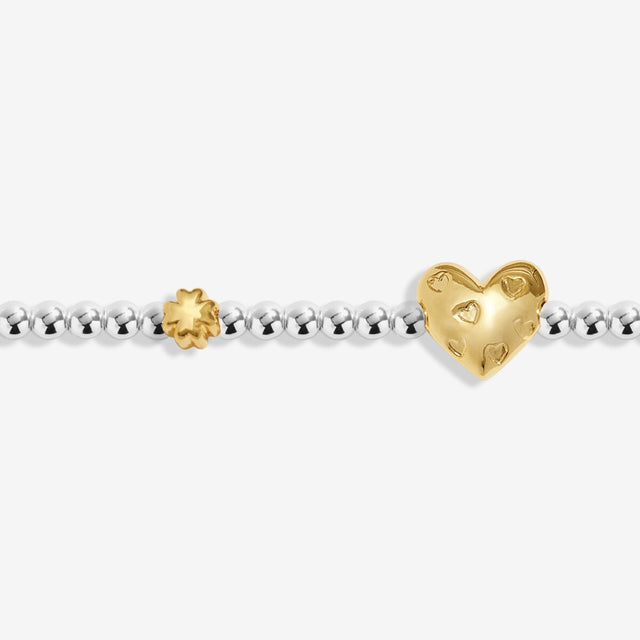 Close-up of heart charm on Joma Jewellery March birth month bracelet