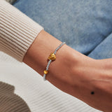 Joma Jewellery March birth month silver and gold-plated bracelet worn on wrist