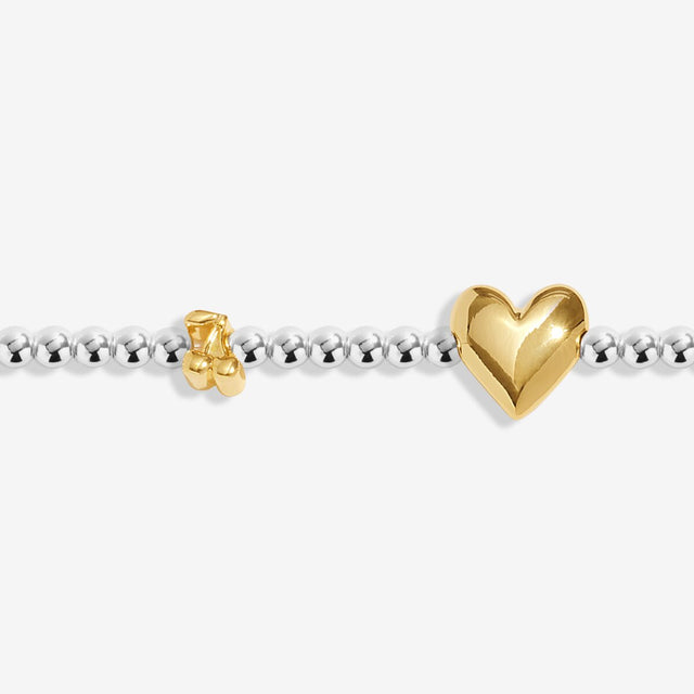 Close-up of heart charm on Joma Jewellery May birth month bracelet