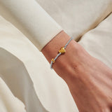 Joma Jewellery May birth month silver and gold-plated bracelet worn on wrist