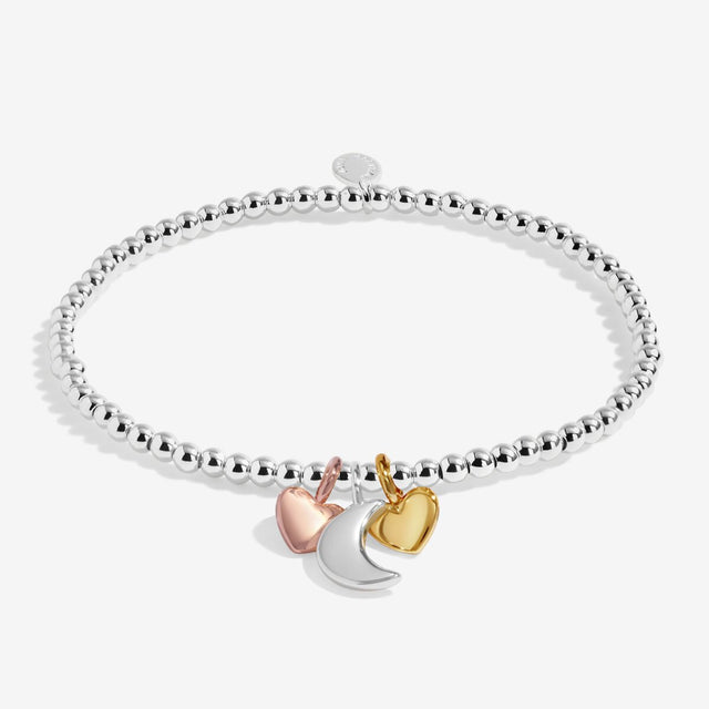 Silver beaded stretch bracelet with silver moon charm and gold and rose gold heart charms