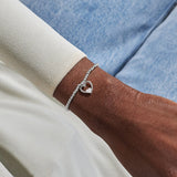 Joma A Little Mummy & Bump silver bracelet worn on wrist