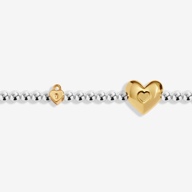 Close-up of heart charm on Joma Jewellery October birth month bracelet