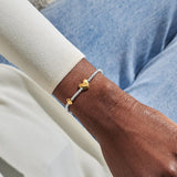 Joma Jewellery October birth month silver and gold-plated bracelet worn on wrist
