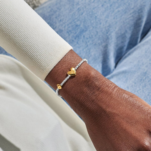 Joma Jewellery October birth month silver and gold-plated bracelet worn on wrist