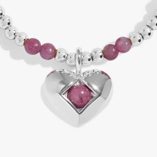 Close-up of tourmaline birthstone heart charm on Joma Jewellery bracelet