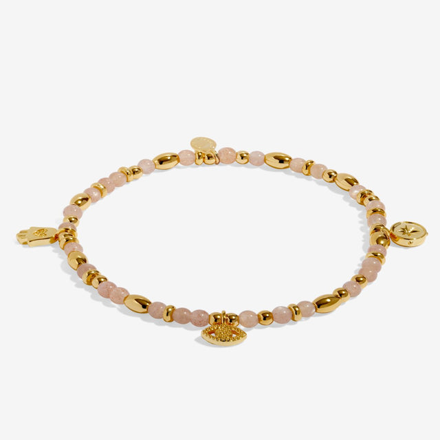 Joma Jewellery Protection gold beaded affirmation bracelet laid flat