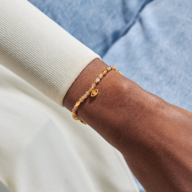 Joma Jewellery Protection gold affirmation bracelet worn on wrist
