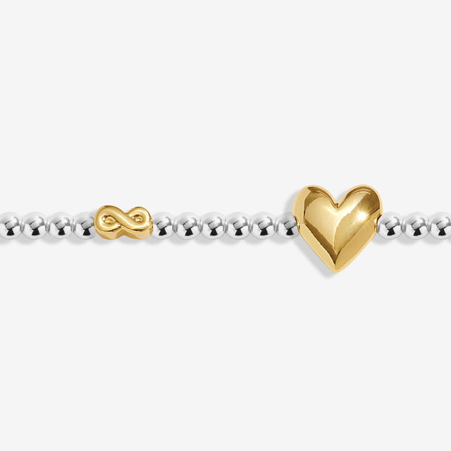 Close-up of heart charm on Joma Jewellery September birth month bracelet
