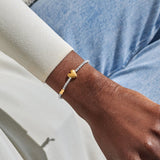 Joma Jewellery September birth month silver and gold-plated bracelet worn on wrist