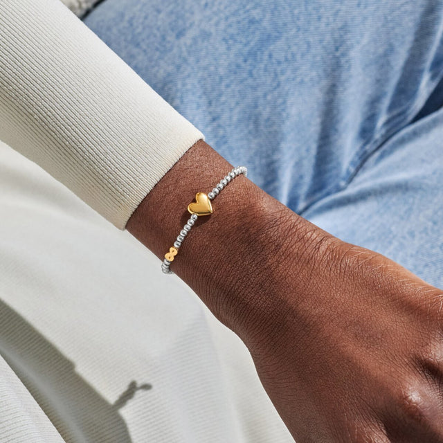 Joma Jewellery September birth month silver and gold-plated bracelet worn on wrist