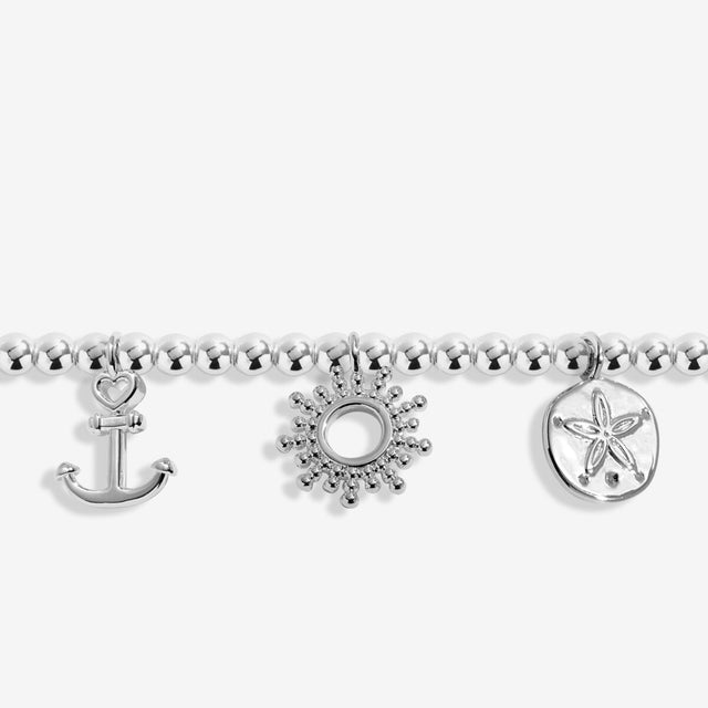 Close-up of silver charm details on Joma Jewellery silver anklet