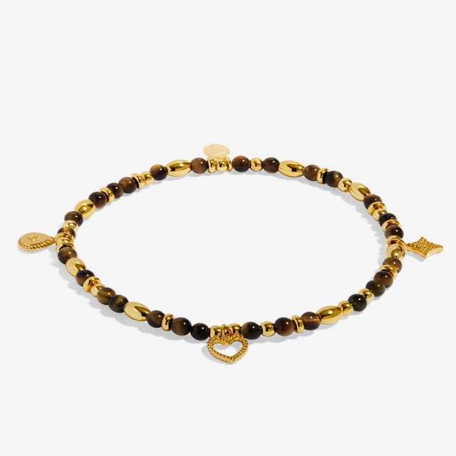 Joma Jewellery Strength gold beaded affirmation bracelet laid flat