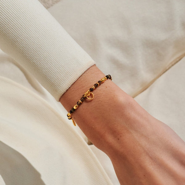 Joma Jewellery Strength gold affirmation bracelet worn on wrist