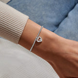 Joma silver thank you heart bracelet worn on wrist