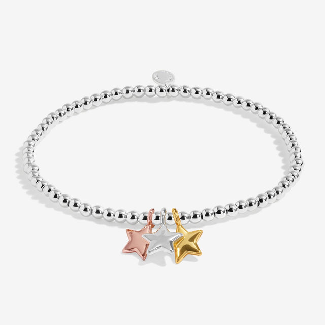 Silver beaded stretch bracelet with silver, gold and rose gold star charms