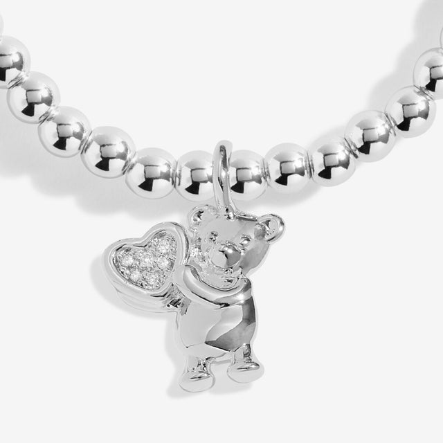Close-up of baby charm on Joma Welcome To The World bracelet