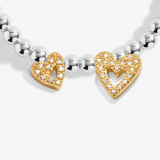 Gold heart charm detail on Wonderful Daughter bracelet