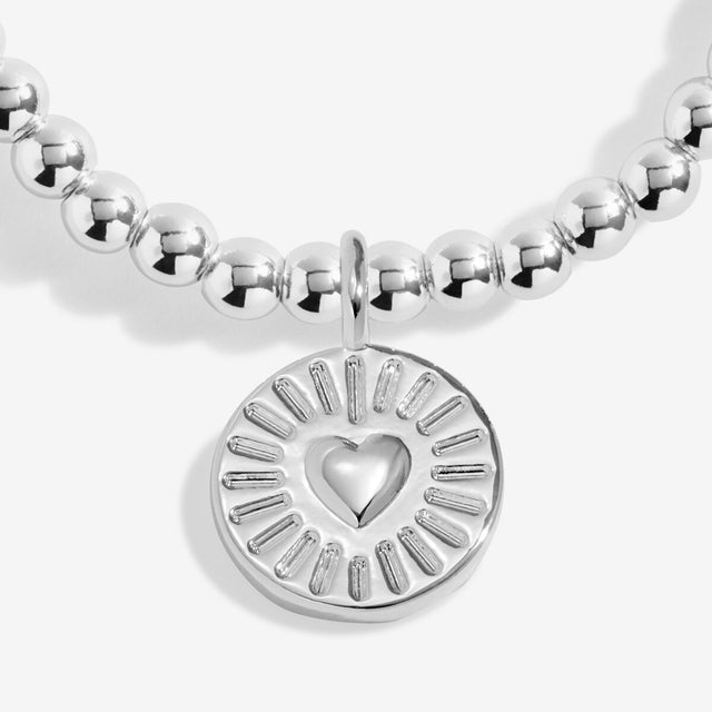 Close-up of heart charm on Joma Jewellery Work Bestie bracelet
