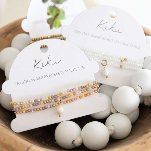 Kiki Marigold Charm crystal jewellery wrap on display card packaging.