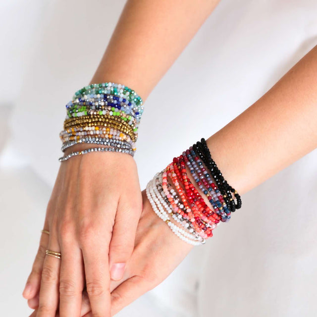 Purple Haze crystal jewellery wrap worn as layered bracelet.