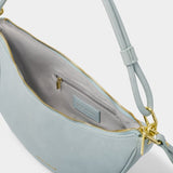 Katie Loxton Asha Sling Bag - Blue Mist Suedette