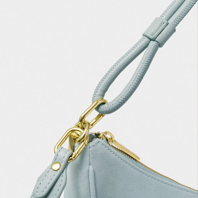 Katie Loxton Asha Sling Bag - Blue Mist Suedette