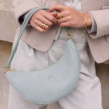 Katie Loxton Asha Sling Bag - Blue Mist Suedette