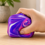 Large Swirl Cube Squishy Fidget Toy being squeezed in hand for stress relief, anxiety reduction and sensory play