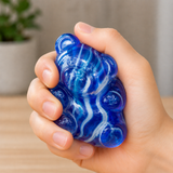 Marble gummy bear squishy fidget toy being squeezed in hand for stress relief, anxiety reduction and sensory play