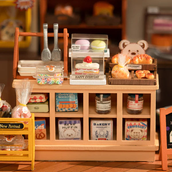 Robotime Rolife kits bakery miniature close-up showing shelves of pastries, jars and baking accessories