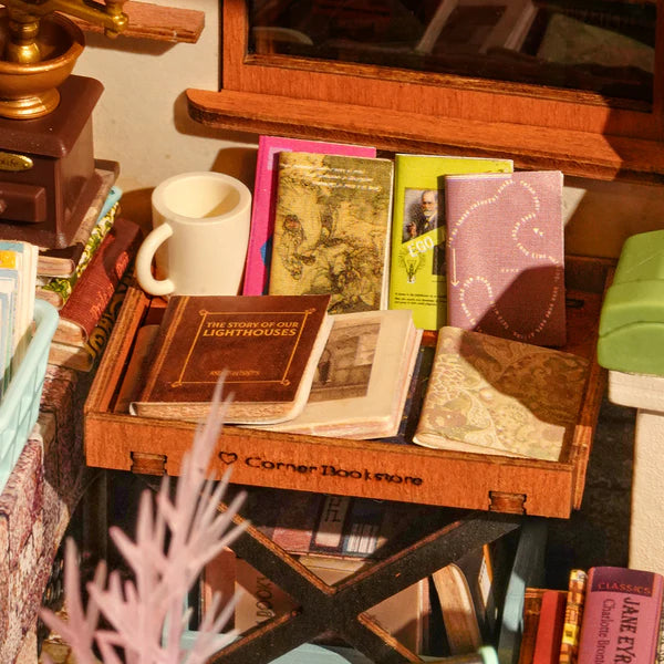 Robotime Rolife kits bookstore miniature close-up with bookshelves, desk and vintage décor details
