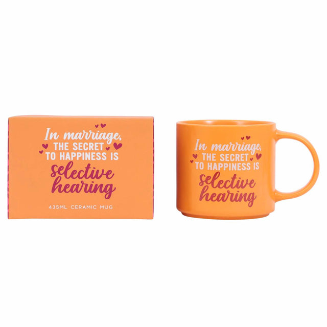 Close-up of Splosh Marriage Mug showing “In marriage, the secret to happiness is selective hearing” quote, funny orange ceramic mug for work or home.