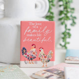 Splosh Cottage Grove Family decorative ceramic fridge magnets displayed with other ceramic magnets in the collection.