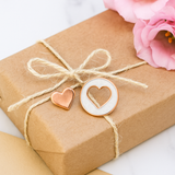 Heart Keepsake Pins presented on a wrapped gift box with ribbon