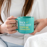 Splosh Snack Coffee Mug in use – funny turquoise mug for coffee and snack lovers, perfect gift for work or home.