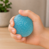 Soft squishy stress ball being squeezed in hand for stress relief, anxiety reduction and sensory play