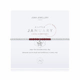 For all January babies, our lovely A Little Joma bracelet radiates birthstone beauty with special Garnet stones and a gently hammered silver circle charm.