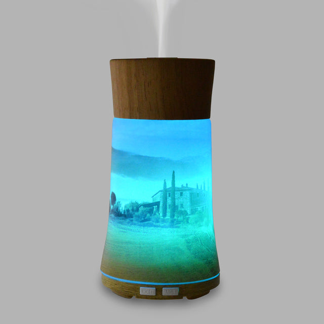 Our Ultrasonic Diffuser is designed to help you relax with your favourite Di Palomo fragrance with the added benefits of aromatherapy. Displaying a beautiful view of a Tuscan vineyard, made from the finest hand-crafted glass and including a mood-enhancing colour changing light, this diffuser is sure to create a sense of calm and relaxation in your home.