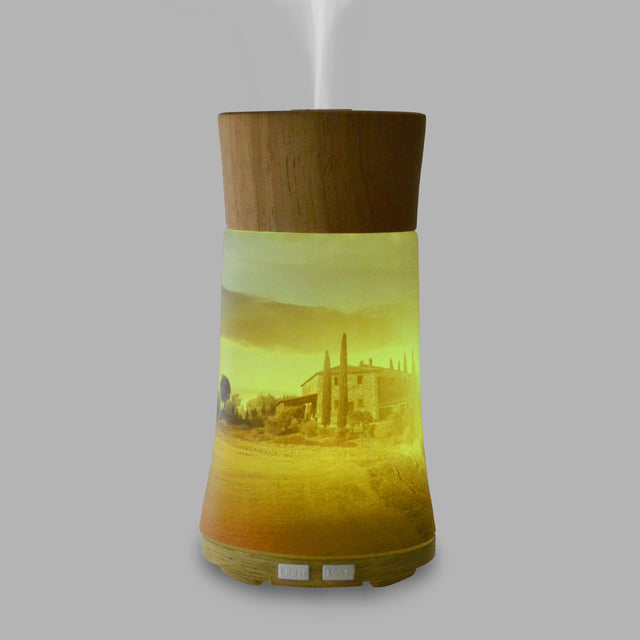 Our Ultrasonic Diffuser is designed to help you relax with your favourite Di Palomo fragrance with the added benefits of aromatherapy. Displaying a beautiful view of a Tuscan vineyard, made from the finest hand-crafted glass and including a mood-enhancing colour changing light, this diffuser is sure to create a sense of calm and relaxation in your home.