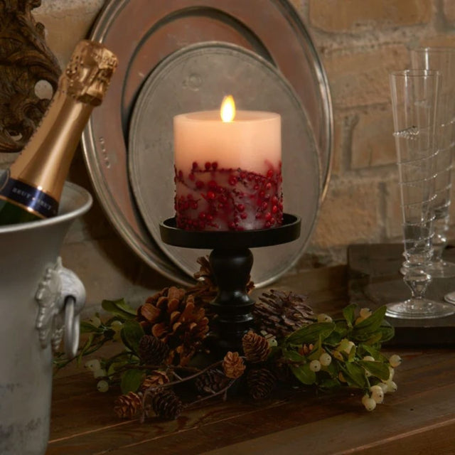 This Luminara Red Berry Inclusions Flameless Pillar is the fashion-forward centerpiece for all your candle dƒecor needs. We selected this modern melted design to showcase the dancing Real-Flame Effect from all angles, ensuring endless decorating possibilities!