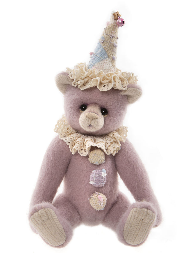  Minnelli is a 10.5" Teddy bear with a five-way jointed body sewn from wool and plush. Her face comes together with a hand-stitched nose, airbrushing and soulful glass eyes backed with ultrasuede disks for an adorable love me look. Minnelli wears a lace neck ruff and lovely clown hat with matching pom poms that dot her tummy. 